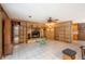 Inviting living area featuring tiled floors, a stone fireplace and built-in shelving at 23797 Ne 189Th St, Fort Mc Coy, FL 32134