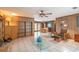 Open-concept living space with tiled flooring and an inviting dining area with natural light at 23797 Ne 189Th St, Fort Mc Coy, FL 32134