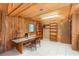 Unique wooden office space featuring wrap around desk, built-in shelving, and abundant natural light at 23797 Ne 189Th St, Fort Mc Coy, FL 32134