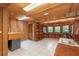 Unique wooden office space featuring wrap around desk, built-in shelving, and abundant natural light at 23797 Ne 189Th St, Fort Mc Coy, FL 32134