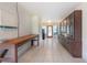 Large utility room with tiled flooring, lots of storage and a wooden work table at 23797 Ne 189Th St, Fort Mc Coy, FL 32134