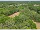 Lush acreage with dense tree cover offers privacy and a serene setting for a custom home or retreat at 2580 Se 157Th Lane Rd, Summerfield, FL 34491