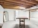 Unfinished basement offers versatility with exposed wood beams, storage, and potential for customization at 2580 Se 157Th Lane Rd, Summerfield, FL 34491
