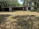 Home featuring a large backyard with detached garage and covered patio at 312 Nw 28Th St, Ocala, FL 34475
