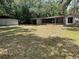 Home featuring a large backyard with detached garage and covered patio at 312 Nw 28Th St, Ocala, FL 34475