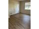 Bright bedroom featuring light walls, closet, and a large window allowing ample natural light at 312 Nw 28Th St, Ocala, FL 34475