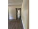 Hallway featuring new wood-look flooring and neutral walls at 312 Nw 28Th St, Ocala, FL 34475