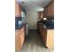 Functional kitchen featuring wood cabinets, modern appliances, and a practical layout for cooking at 312 Nw 28Th St, Ocala, FL 34475