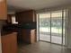 Kitchen with wood cabinets and sliding glass doors leading to the outdoor patio at 312 Nw 28Th St, Ocala, FL 34475