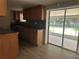 Kitchen showcasing wood cabinets and a sliding glass door to the patio at 312 Nw 28Th St, Ocala, FL 34475