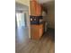 View of the kitchen featuring wood cabinets and white appliances at 312 Nw 28Th St, Ocala, FL 34475