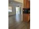 Open-concept living room with neutral walls, modern flooring, and direct access to kitchen and front door at 312 Nw 28Th St, Ocala, FL 34475