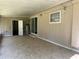 Large tiled patio with access to the house and yard at 312 Nw 28Th St, Ocala, FL 34475