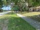 Property featuring mature trees, grassy lawn and Powerhouse Ministry sign at 312 Nw 28Th St, Ocala, FL 34475