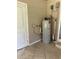 Indoor water heater on a tiled floor in a utility area at 312 Nw 28Th St, Ocala, FL 34475