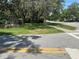 Property featuring mature trees, grassy lawn and chain link fence at 312 Nw 28Th St, Ocala, FL 34475