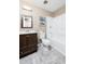Cozy bathroom with wood-look floors, white vanity countertop, and shower and bathtub combo at 340 Oak Track Loop, Ocala, FL 34472