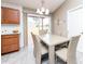 Bright dining area featuring modern table and chairs with sliding door access to the backyard at 340 Oak Track Loop, Ocala, FL 34472