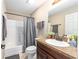 Bathroom featuring a shower-tub combo, a single sink vanity, and neutral walls at 3887 Sw 156Th Pl, Ocala, FL 34473
