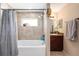 Bathroom with a tiled tub and shower combination, vanity, and neutral walls at 3887 Sw 156Th Pl, Ocala, FL 34473