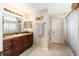 Bathroom featuring a single sink vanity with dark wood cabinets and a tile floor at 3887 Sw 156Th Pl, Ocala, FL 34473