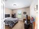 A bedroom featuring a comfortable bed, a window letting in natural light, and simple decor, creating a cozy atmosphere at 3887 Sw 156Th Pl, Ocala, FL 34473