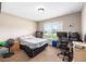 Bedroom with a bed, carpet, desk and chair and natural light from a window at 3887 Sw 156Th Pl, Ocala, FL 34473