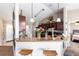 Open kitchen with granite countertops, dark wood cabinets, and breakfast bar seating at 3887 Sw 156Th Pl, Ocala, FL 34473
