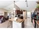 Modern kitchen with granite countertops, dark wood cabinetry, and open concept design at 3887 Sw 156Th Pl, Ocala, FL 34473