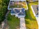 An aerial shot of a charming home featuring a well-kept yard, highlighting its curb appeal and neighborhood setting at 3897 Sw 169Th Lane Rd, Ocala, FL 34473