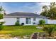 A well-maintained backyard with a manicured lawn, tasteful landscaping, and a charming pergola, perfect for outdoor enjoyment at 3897 Sw 169Th Lane Rd, Ocala, FL 34473