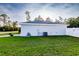 The backyard features green grass and a side view of the home's exterior at 3897 Sw 169Th Lane Rd, Ocala, FL 34473