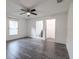 Bright bedroom with a ceiling fan, closet, and view into an ensuite bathroom at 3897 Sw 169Th Lane Rd, Ocala, FL 34473