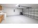 Spacious garage with cabinets, laundry, and overhead door at 3897 Sw 169Th Lane Rd, Ocala, FL 34473