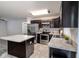Modern kitchen featuring stainless steel appliances, center island, and granite countertops at 3897 Sw 169Th Lane Rd, Ocala, FL 34473