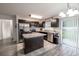 Bright kitchen with stainless steel appliances, center island, and sliding glass doors at 3897 Sw 169Th Lane Rd, Ocala, FL 34473
