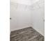 Empty walk-in closet with wire shelving and gray wood flooring at 3897 Sw 169Th Lane Rd, Ocala, FL 34473