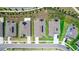 Aerial view of neighborhood homes with solar panels and well manicured lawns at 5248 Red Coral Cir, Mount Dora, FL 32757