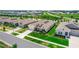 An aerial view shows a lovely home with a manicured lawn in a neighborhood with a well maintained green spaces at 5248 Red Coral Cir, Mount Dora, FL 32757
