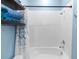 Clean, white shower-tub combination with blue accents at 5248 Red Coral Cir, Mount Dora, FL 32757
