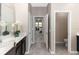 Bathroom with a glimpse into the bedroom, showing a clean and stylish layout at 5248 Red Coral Cir, Mount Dora, FL 32757