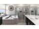 Bathroom featuring a soaking tub, glass-enclosed shower, and dual vanity sinks at 5248 Red Coral Cir, Mount Dora, FL 32757
