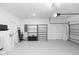 Clean and spacious garage interior with storage racks and plenty of room for vehicles at 5248 Red Coral Cir, Mount Dora, FL 32757
