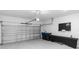 Spacious two-car garage featuring ample storage and an automatic door opener at 5248 Red Coral Cir, Mount Dora, FL 32757