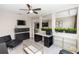 Open-concept living room with stylish decor and ample natural light at 5248 Red Coral Cir, Mount Dora, FL 32757