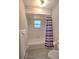 Bathroom with shower-tub combo, toilet, and towel rack at 5410 Nw 62Nd Ave, Ocala, FL 34482
