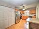 Efficient kitchen with stainless steel refrigerator and ample counter space for meal preparation at 5410 Nw 62Nd Ave, Ocala, FL 34482