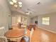 Open-concept living room with dining area, creating a spacious and inviting atmosphere at 5410 Nw 62Nd Ave, Ocala, FL 34482