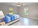 Serene main bedroom with ample natural light and tile floors, creating a peaceful retreat at 5410 Nw 62Nd Ave, Ocala, FL 34482
