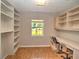 Home office space with built-in shelving and ample natural light, perfect for productivity at 5410 Nw 62Nd Ave, Ocala, FL 34482